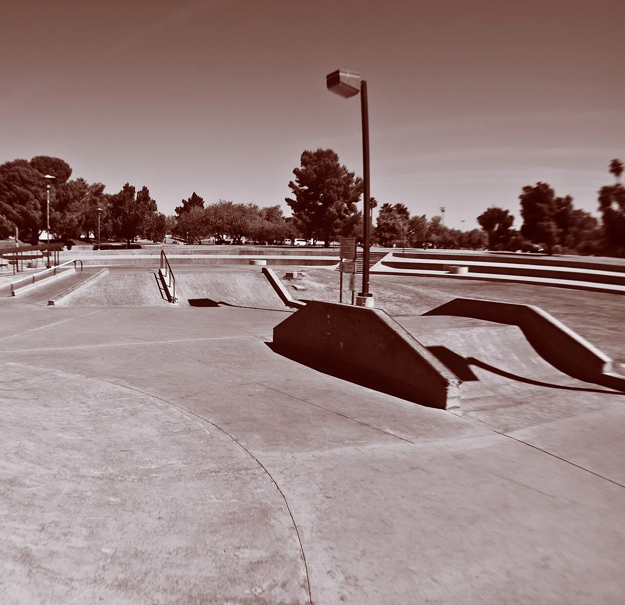The Wedge skate area at Eldorado Park in Scottsdale, with shade trees lining the Greenbelt beyond