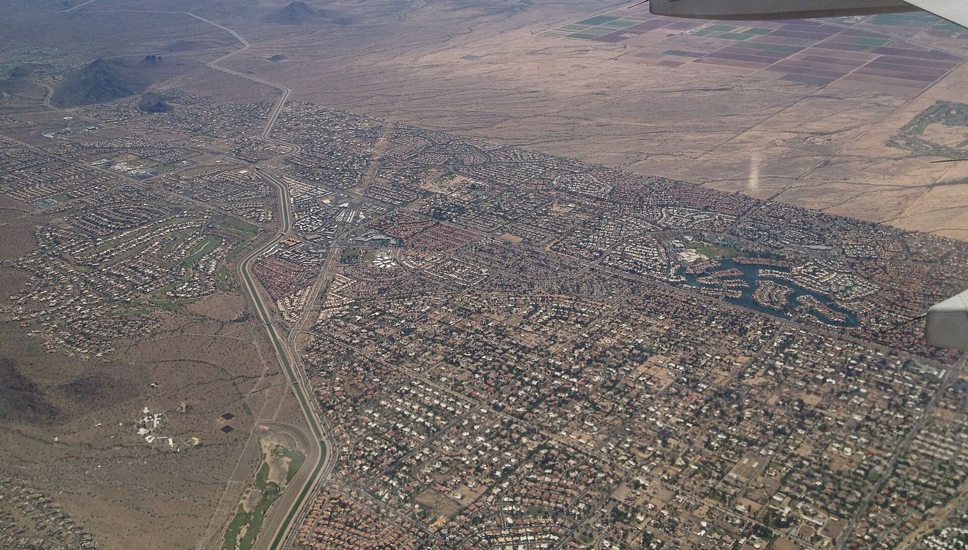 Aerial view of Scottsdale, Arizona in 2013, showing the city spread between canals, golf courses, and desert mountains